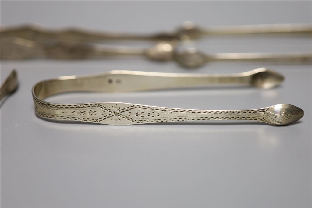 Six pairs of assorted 18th and 19th century silver sugar tongs including one bright cut engraved by Hester Bateman,